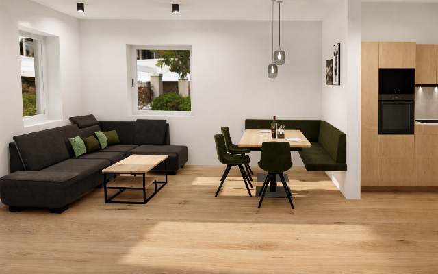 Große und gemütliche Wohnküche mit Essecke, Couch und Flat-TV