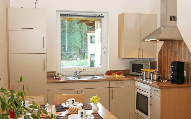 Spacious kitchen in country house style