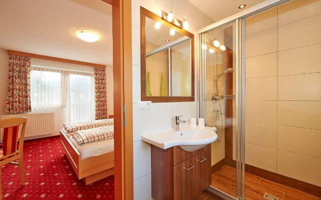 Bedroom with double bed and shower/toilet