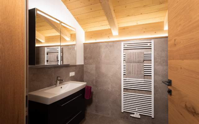 Spacious bathroom with towel warmer