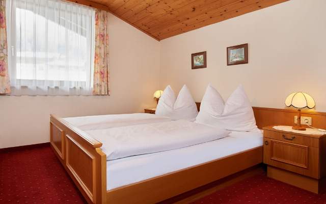 Cozy bedroom for a relaxing stay in Flachau