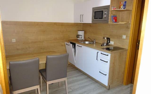 Compact and fully equipped kitchen in the apartment