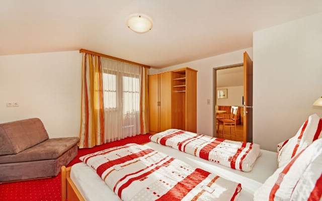 Spacious bedroom with high quality beds and balcony