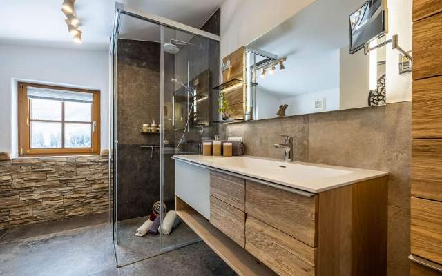 Newly renovated bathroom with sink and large shower