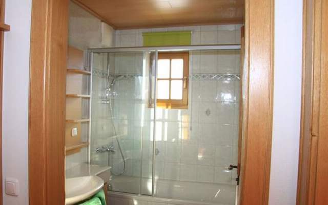 Bathroom with shower tray and sink