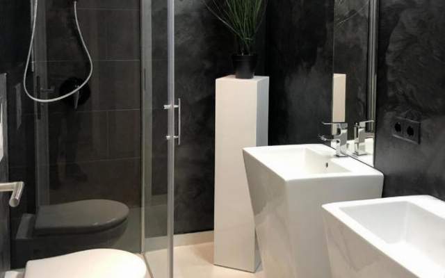 High-quality bathroom with shower, double sink and toilet